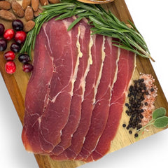 Angel’s Salumi and Truffles – Wild Boar Prosciutto Slices Served with Figs, Olives, and Balsamic Glaze