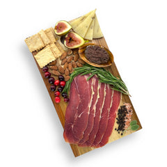 Wild Boar Prosciutto sliced and displayed on a gourmet charcuterie board, showcasing its rich, savory flavor and artisanal craftsmanship.
