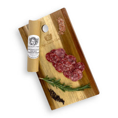 White Truffle Salami sliced and served on a gourmet charcuterie board, showcasing its artisanal natural casing and the rich truffle aroma.