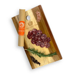 Wild Boar Salami sliced and presented on a gourmet charcuterie board, showcasing its darker, richer color and Mediterranean-inspired flavor profile.