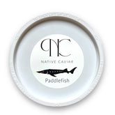 8oz tub of American Paddlefish Caviar featuring medium olive-to-steel-gray pearls — sustainably harvested sturgeon roe alternative with rich, buttery flavor, perfect for gourmet appetizers and elegant entertaining