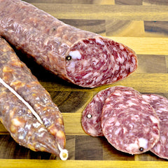 Angel’s Salumi and Truffles – Sliced Toscano Salami with Black Peppercorn, Garlic, and White Wine on Charcuterie Board